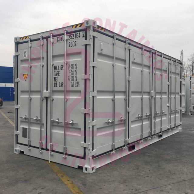 A shipping container with weight specifications, located in a yard, featuring a logo overlay.