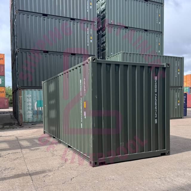 A stack of shipping containers at a port, with 